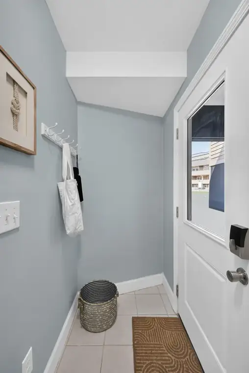 Entry hallway with hooks for beach bags