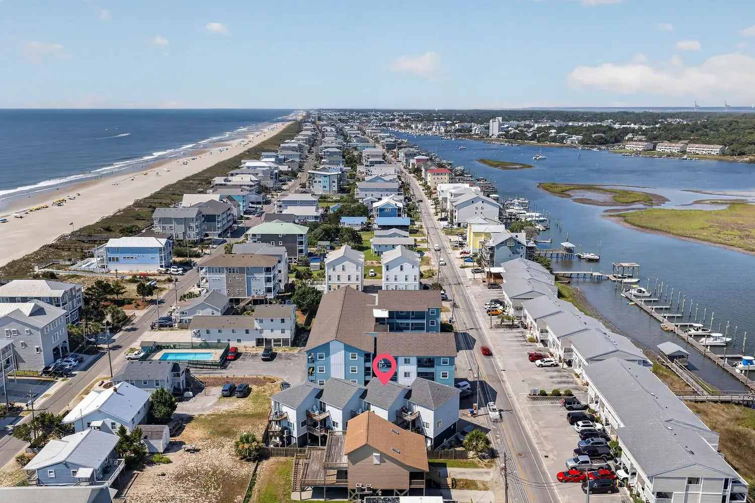 Aerial photo of Carolina Beach showing the ocean, Canal Drive, and the marina